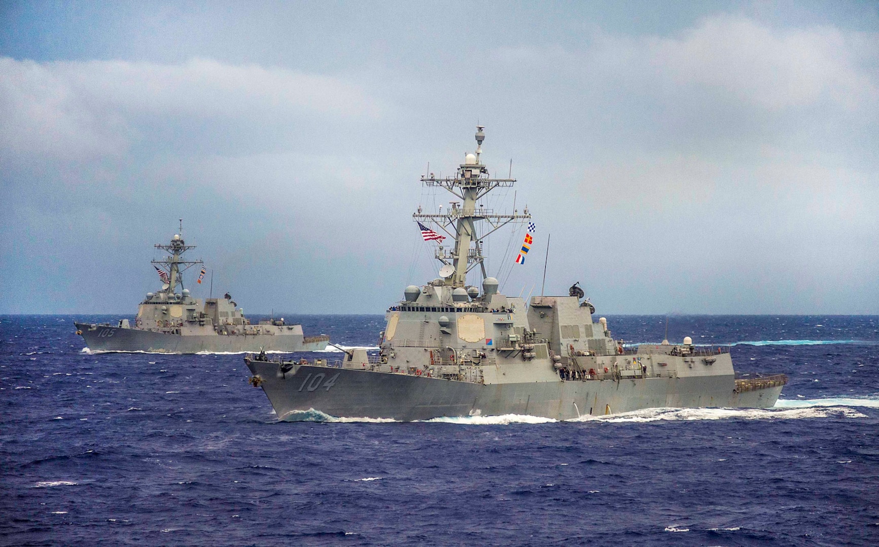 File photo:  The guided-missile destroyers USS Sterett (DDG 104), front, and USS Dewey (DDG 105) maneuver into formation during the conclusion of Valiant Shield 2014. Valiant Shield is a U.S.-only exercise integrating U.S. Navy, Air Force, Army, and Marine Corps assets, offering real-world joint operational experience to develop capabilities that provide a full range of options to defend U.S. interests and those of its allies and partners. 