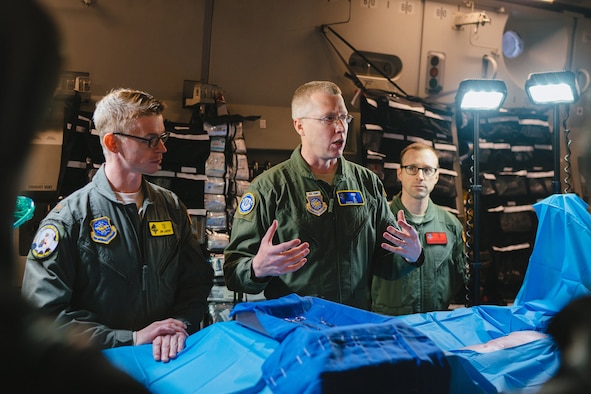 Maj. Denial Cox, the Office of the Command Surgeon medical director for en route care, briefs congressional staff members on flight surgical capabilities during the 2017 Rapid Global Mobility Airpower Orientation at Joint Base Andrews, Md., March 31, 2017. (U.S. Air Force photo/Senior Airman Delano Scott)