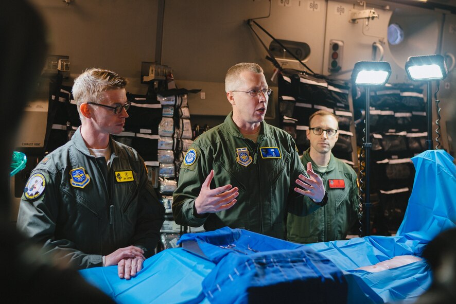 Maj. Denial Cox, the Office of the Command Surgeon medical director for en route care, briefs congressional staff members on flight surgical capabilities during the 2017 Rapid Global Mobility Airpower Orientation at Joint Base Andrews, Md., March 31, 2017. (U.S. Air Force photo/Senior Airman Delano Scott)