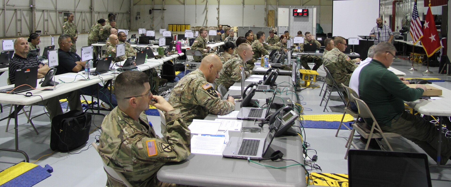 Soldiers and civilians assigned to Task Force-51, U.S. Army North (Fifth Army) conduct a Commander’s Update Brief during Exercise Vigilant Guard on Dobbins Air Force Reserve Base, outside of Atlanta Ga., March 26. Vigilant Guard involves county, state, federal agencies working with the Dept. of Defense to coordinate response to a simulated level three hurricane. 