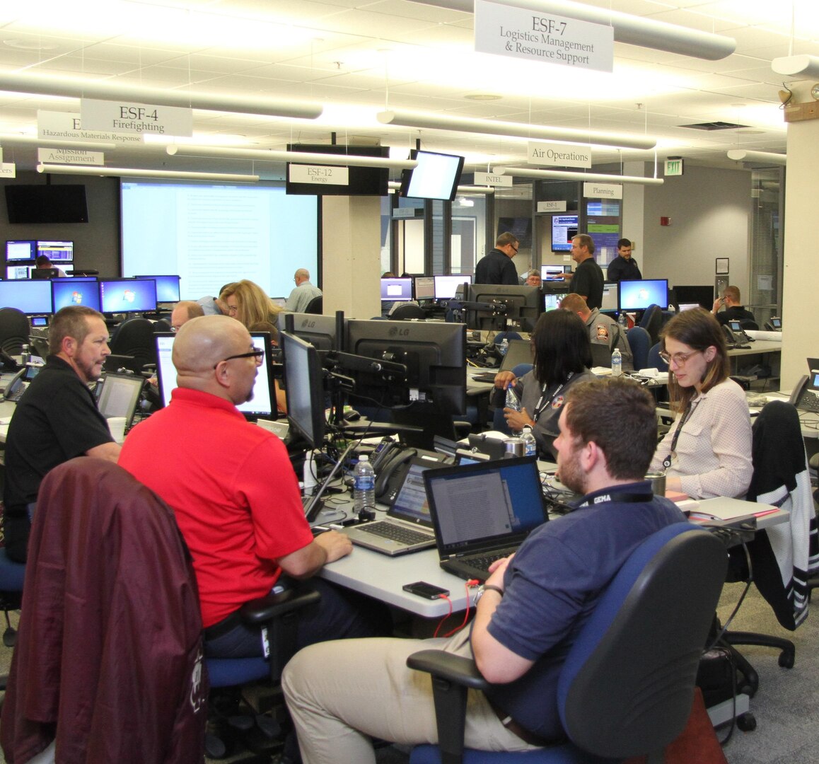 County and state agencies work together at the Georgia Emergency Management Authority Center in Atlanta during Exercise Vigilant Guard March 26. Vigilant Guard involves county, state, federal agencies working with the Dept. of Defense to coordinate response to a simulated level-three hurricane. 