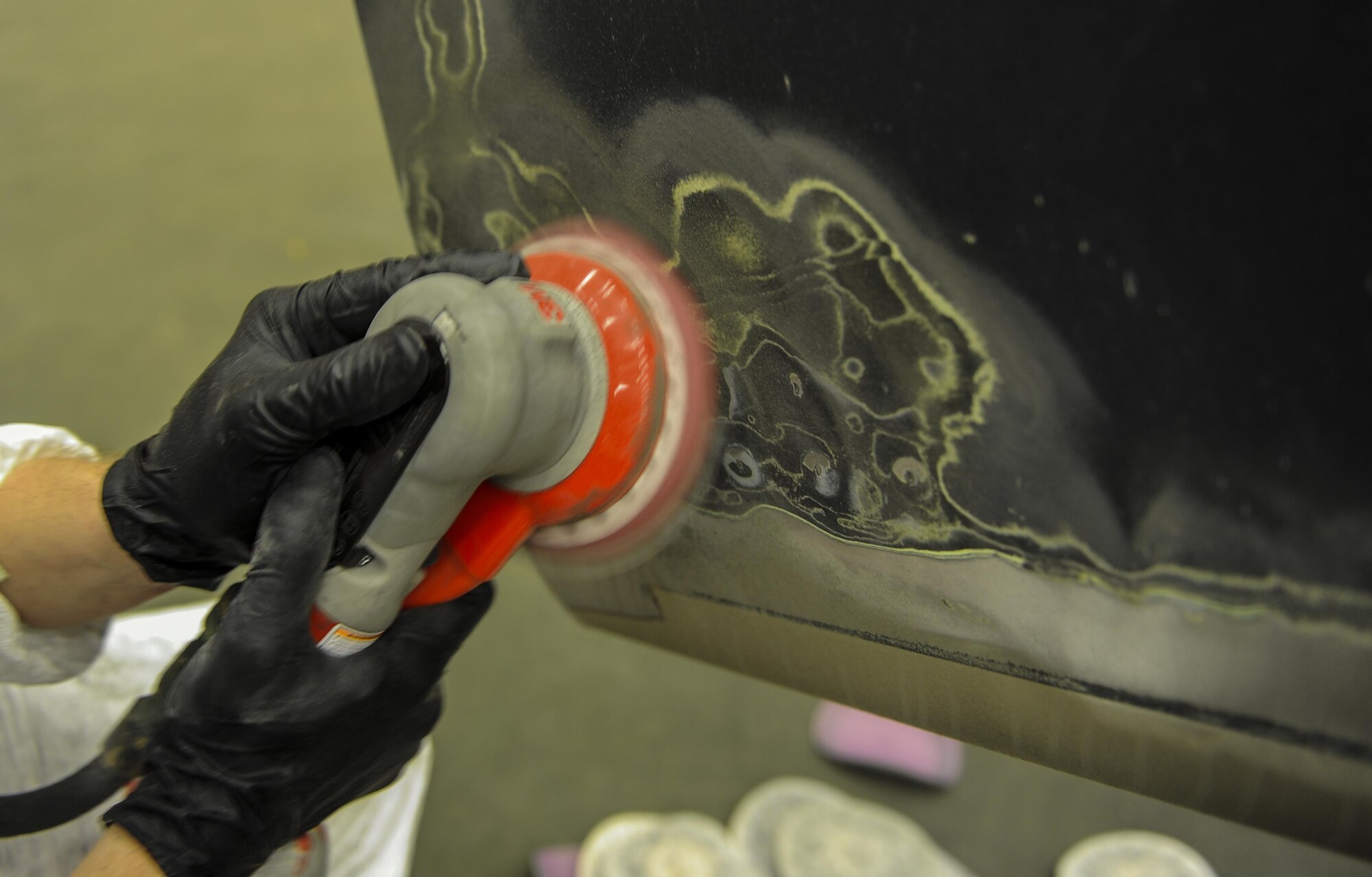 Airman 1st Class Ethan Short, an aircraft structural maintainer with the 1st Special Operations Maintenance Squadron, sands down a propeller to remove paint from a CV-22 Osprey at Hurlburt Field, Fla., March 28, 2017. Corrosion control Airmen restore the structural integrity of aircraft by repainting parts of the body that have been weakened by exposure to the environment and conducting composite repairs, prolonging the life of the asset. (U.S. Air Force photo by Airman 1st Class Isaac O. Guest IV) 