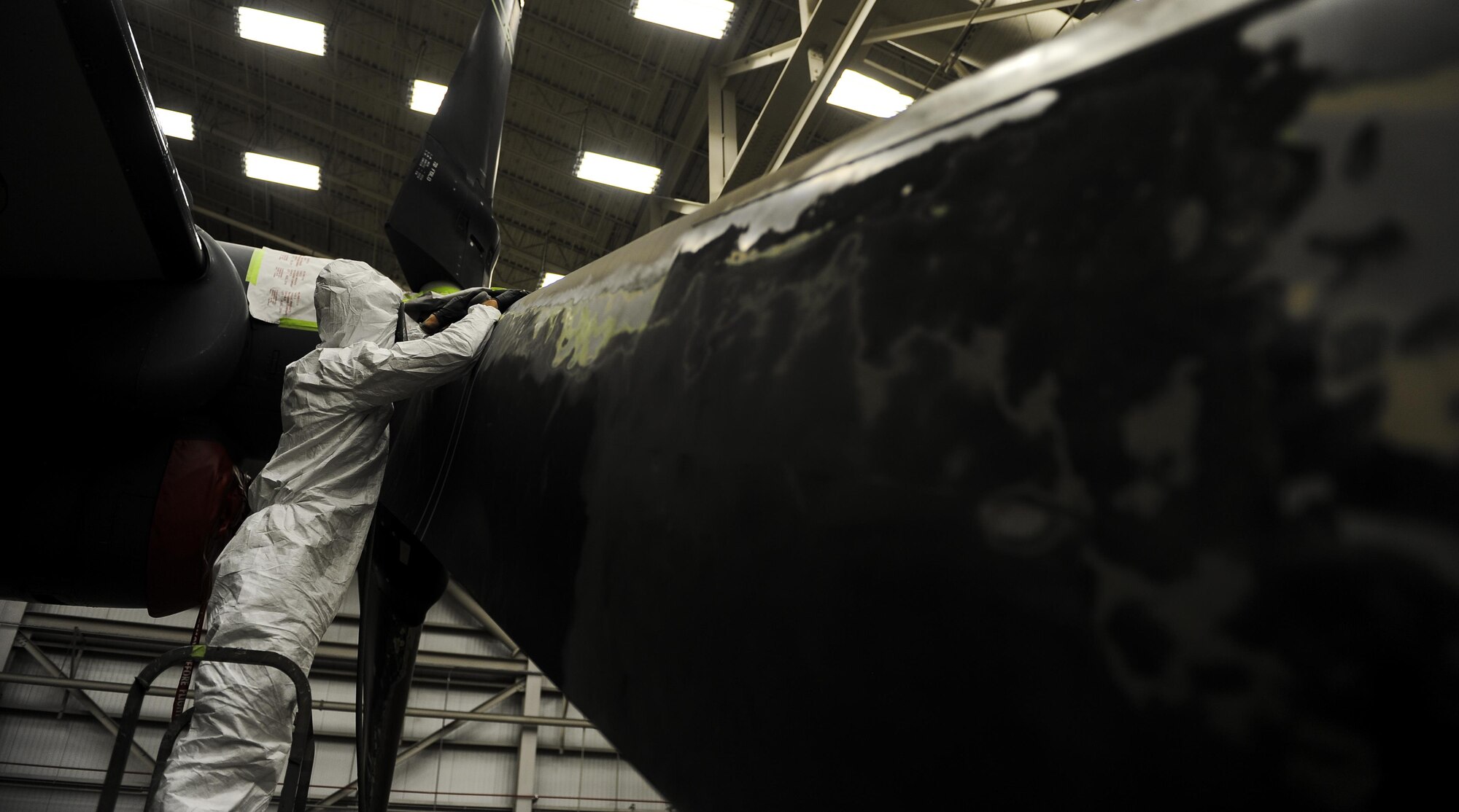 Airman 1st Class Logan Winningham, an aircraft structural maintainer with the 1st Special Operations Maintenance Squadron, sands down a propeller to remove paint from a CV-22 Osprey at Hurlburt Field, Fla., March 28, 2017. Sanding down the equipment is the first step in a several day process to ensure the new primer and paint adhere to the surface of the aircraft. (U.S. Air Force photo by Airman 1st Class Isaac O. Guest IV)