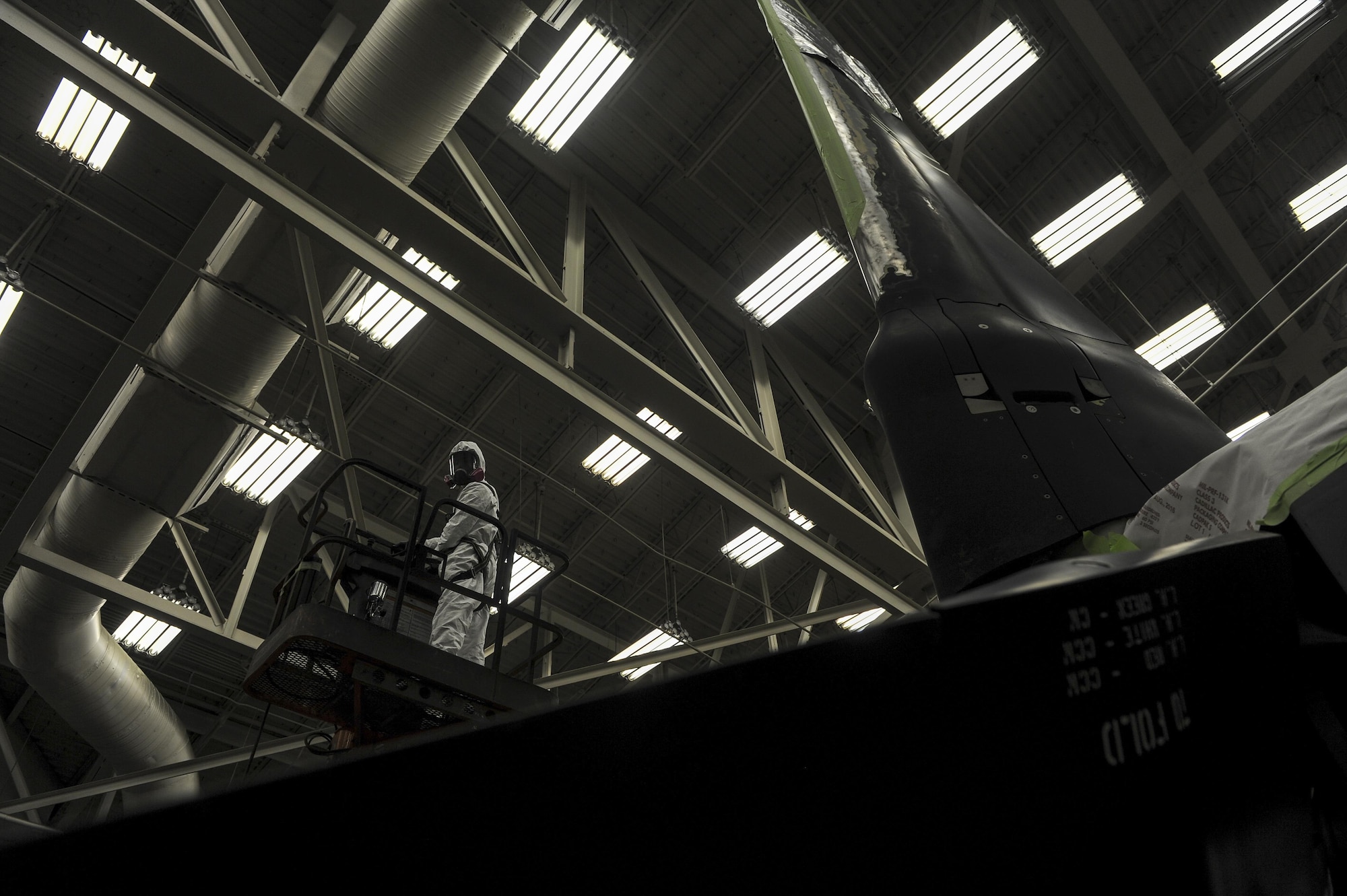 Airman 1st Class Logan Winningham, an aircraft structural maintainer with the 1st Special Operations Maintenance Squadron, uses a lift to get in position to spray primer onto a CV-22 Osprey propeller at Hurlburt Field, Fla., March 29, 2017. Primer is applied after the old paint is sanded and wiped away. (U.S. Air Force photo by Airman 1st Class Isaac O. Guest IV)