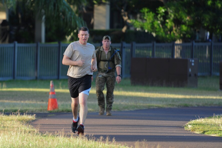 Volunteers jog on the running path overlooking Pearl Harbor during the 6th Annual Tactical Air Control Party (TACP) Association’s Remembrance Run on Joint Base Pearl Harbor-Hickam, Hawaii, March 30, 2017.  Members of the 25th Air Support Operations Squadron organized and participated in a 24-hour run challenge.  The TACP Association seeks to “remember the fallen, honor the living, and aid brothers in need,” by providing support to TACPs who were wounded and assisting the families of those killed in action.  The event is held world-wide, with every TACP unit starting the run at noon local time.  (U.S. Air Force photo by Tech. Sgt. Heather Redman)