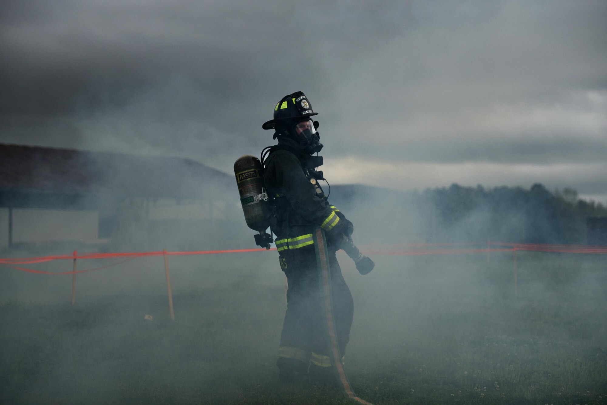 U.S. Air Force Senior Airman Lance Hendricks, 19th Civil Engineer Squadron Fire Department firefighter, responds to a simulated aircraft crash site during a major accident response inspection March 30, 2017, at the Jacksonville Fire Department Training Center, Ark. The goal of the exercise was to evaluate Team Little Rock’s response to an aircraft mishap. (U.S. Air Force photo by Airman 1st Class Kevin Sommer Giron)