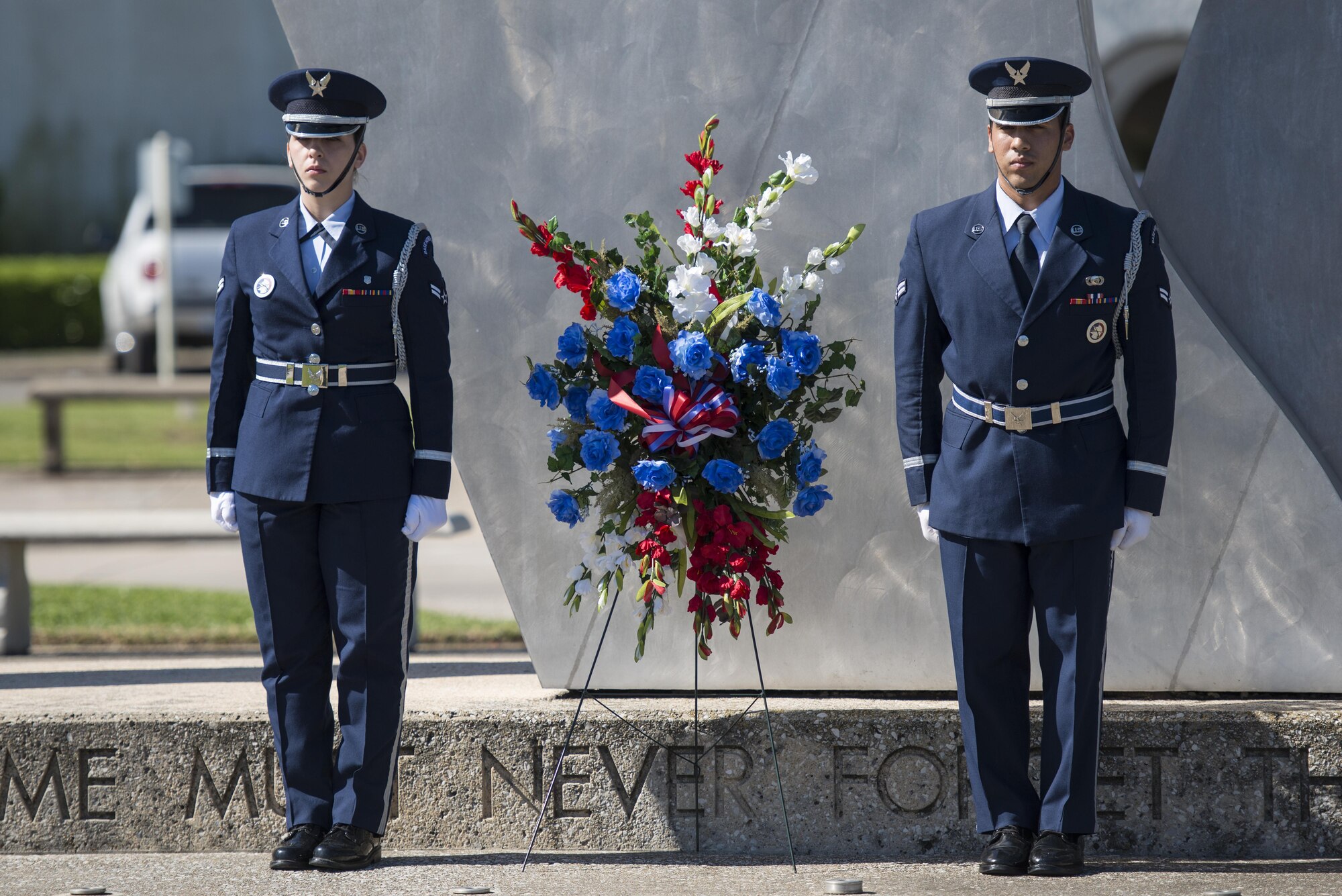 Joint Base San Antonio Honor Guard members lay a wreath at the Missing Man Monument during the Freedom Flyer Reunion wreath laying ceremony March 31, 2017, at Joint Base San Antonio-Randolph, Texas. The event honors all prisoners of war and missing in action service members from the Vietnam War and included a wreath-laying ceremony and a missing man formation flyover.  (U.S. Air Force photo by Sean M. Worrell) 