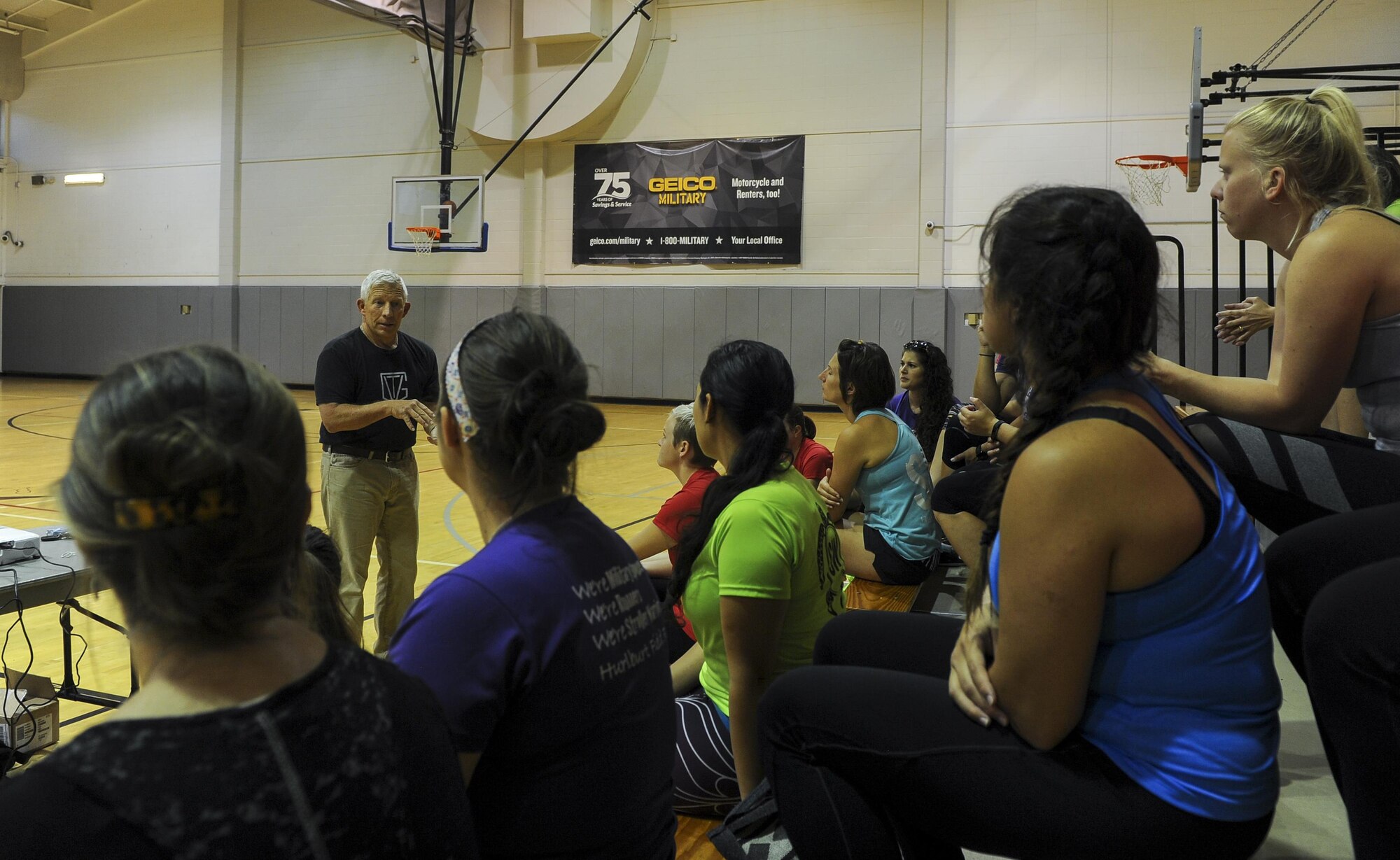 Michael “Moose” Moore, founder and CEO of The Vigilance Group, gives a presentation to a group of Air Commando spouses on awareness, avoidance and actions to take during assaults at Hurlburt Field, March 31, 2017. The Stroller Warriors Running Club hosted The Vigilance Group to offer individuals the opportunity to learn preventive security training. Techniques such as hammer fists, palm strikes, chock defenses and bear hug escapes were demonstrated. (U.S. Air Force photo by Airman 1st Class Isaac O. Guest IV)