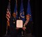 Maj. Gen. Anthony Cotton, 20th Air Force and Task Force 214 commander,  presents Barbara Lutz, 20th Air Force executive assistant to the commander, with her retirement certificate at F.E. Warren Air Force Base, Wyo.,  Mar. 31, 2017.  Lutz is retiring after 43 years of distinguished federal civil service. 