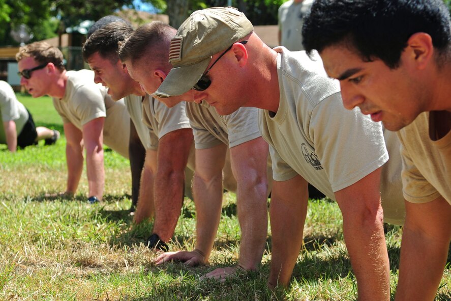 Volunteers do push-ups on the running path overlooking Pearl Harbor during the 6th Annual Tactical Air Control Party (TACP) Association’s Remembrance Run on Joint Base Pearl Harbor-Hickam, Hawaii, March 30, 2017.  Members of the 25th Air Support Operations Squadron organized and participated in a 24-hour run challenge.  The TACP Association seeks to “remember the fallen, honor the living, and aid brothers in need,” by providing support to TACPs who were wounded and assisting the families of those killed in action.  The event is held world-wide, with every TACP unit starting the run at noon local time.  (U.S. Air Force photo by Tech. Sgt. Heather Redman)