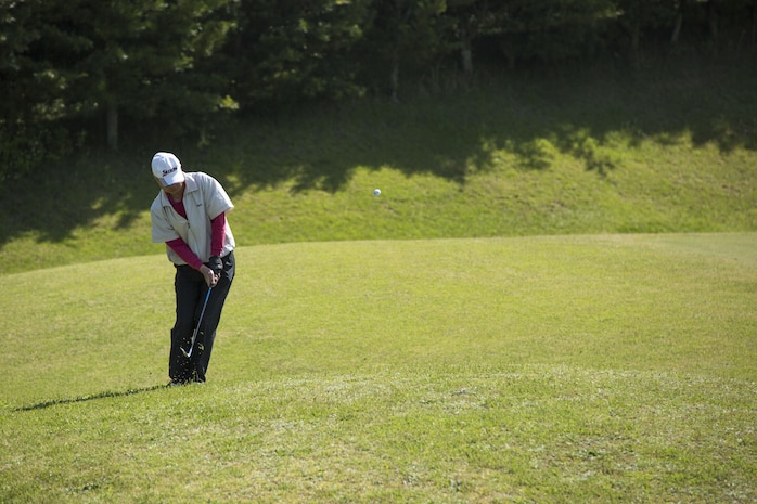 A participant in the 4th Annual Active-Duty Fund Drive in support of the Navy-Marine Corps Relief Society Golf Tournament chips a ball toward the hole at the Iwakuni Country Club in Iwakuni City, Japan, April 28, 2017. The tournament raised funds for the NMCRS, which provides emergency financial assistance to active-duty and retired Navy and Marine Corps personnel and their families. (U.S. Marine Corps photo by Pfc. Stephen Campbell)