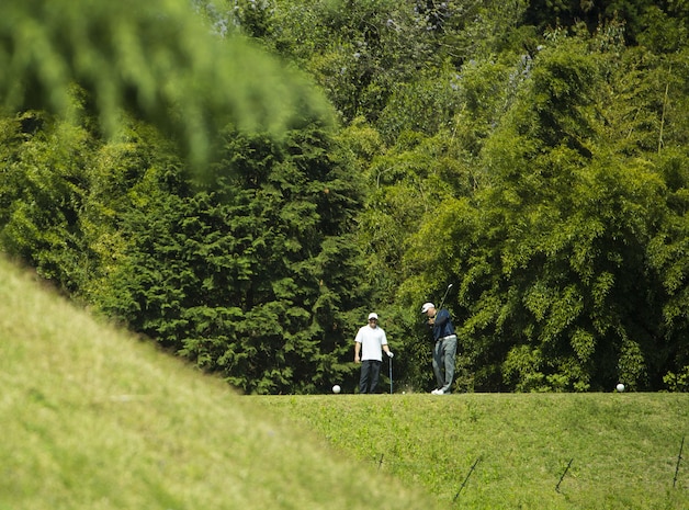 A participant in the 4th Annual Active-Duty Fund Drive in support of the Navy-Marine Corps Relief Society Golf Tournament drives a ball at the Iwakuni Country Club in Iwakuni City, Japan, April 28, 2017. The tournament raised funds for the NMCRS, which provides emergency financial assistance to active-duty and retired Navy and Marine Corps personnel and their families. (U.S. Marine Corps photo by Pfc. Stephen Campbell)