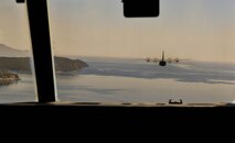 A U.S. Air Force C-130J Super Hercules flies over the Greek coastline during Exercise Stolen Cerberus IV near Elefsis Air Base, Greece, April 26, 2017. Approximately 80 paratroopers exited from two C-130s for static-line and military free fall jumps. The purpose of the exercise was to train U.S. and Greek forces while strengthening the partnership between two NATO allies. (U.S Air Force photo by Senior Airman Tryphena Mayhugh)