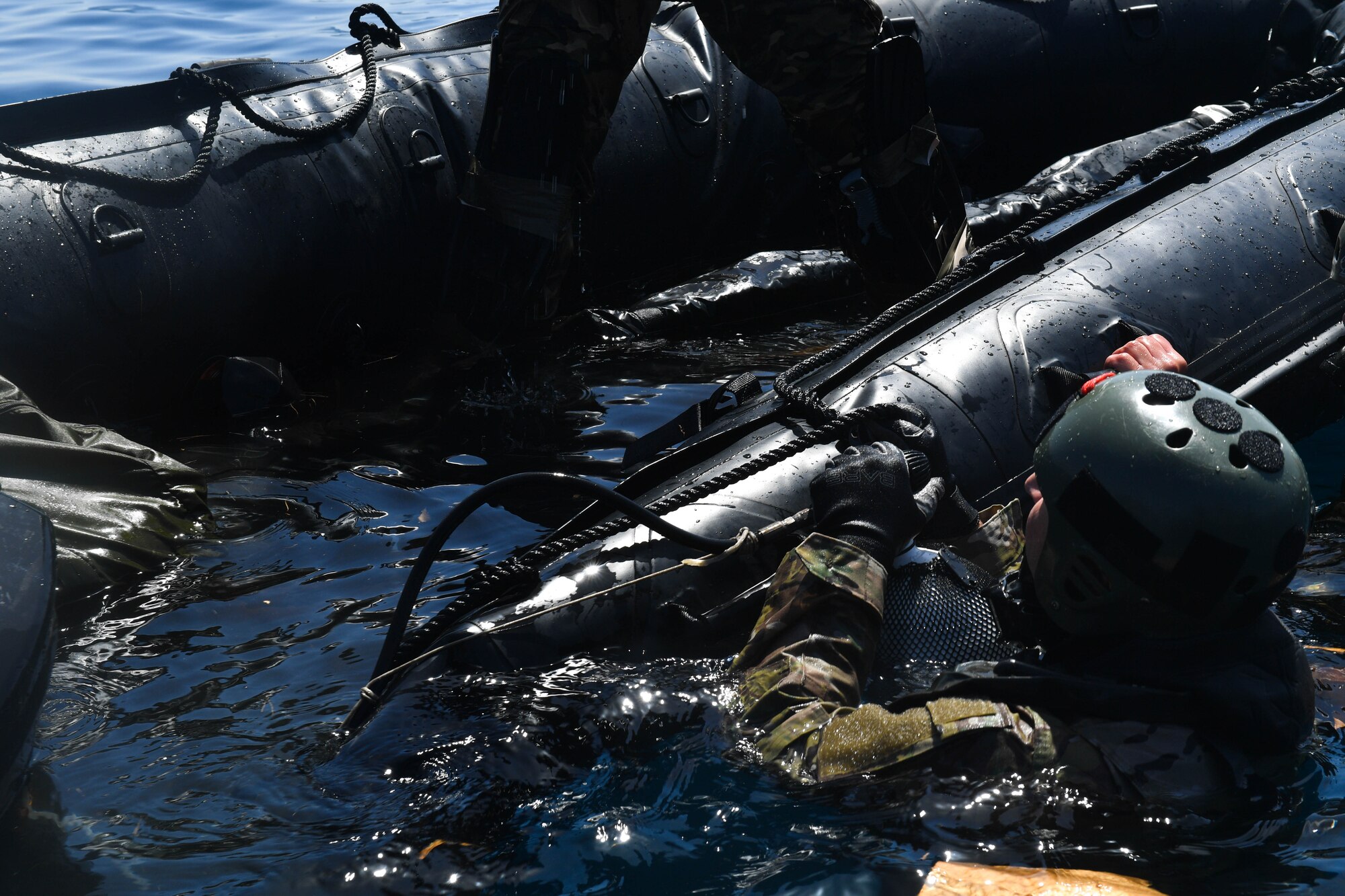 A Greek paratrooper inflates a Zodiac raft during Exercise Stolen Cerberus IV near Elefsis Air Base, Greece, April 27, 2017. The raft and six Greek paratroopers were dropped from a U.S. Air Force C-130J Super Hercules into the Mediterranean Sea. Approximately 110 Airmen and three C-130s from the 86th Airlift Wing’s 37th AS, Ramstein Air Base, Germany, participated in Exercise Stolen Cerberus IV with the Hellenic air force and the U.S. Army from April 18 to 28. (U.S Air Force photo by Senior Airman Tryphena Mayhugh)