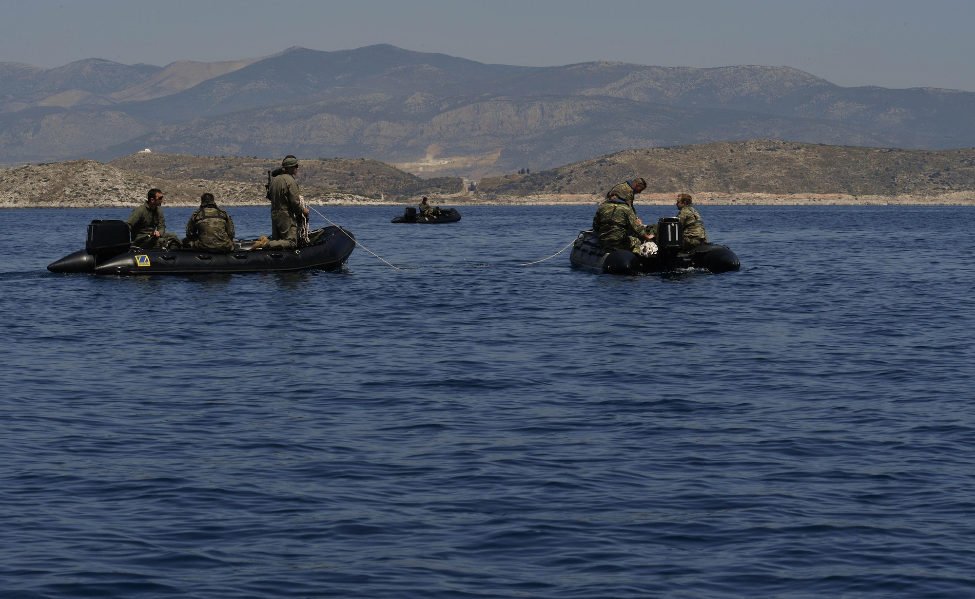 Greek servicemembers gather a sea-rescue kit out of the Mediterranean Sea during Exercise Stolen Cerberus IV near Elefsis Air Base, Greece, April 27, 2017. U.S. Air Force and Army servicemembers trained alongside their Greek partners to conduct these drops for the first time during this fourth iteration of the exercise. As NATO allies, the U.S. and Greece share a commitment to promote peace and stability, and seek opportunities to continue developing their strong relationship. (U.S Air Force photo by Senior Airman Tryphena Mayhugh)