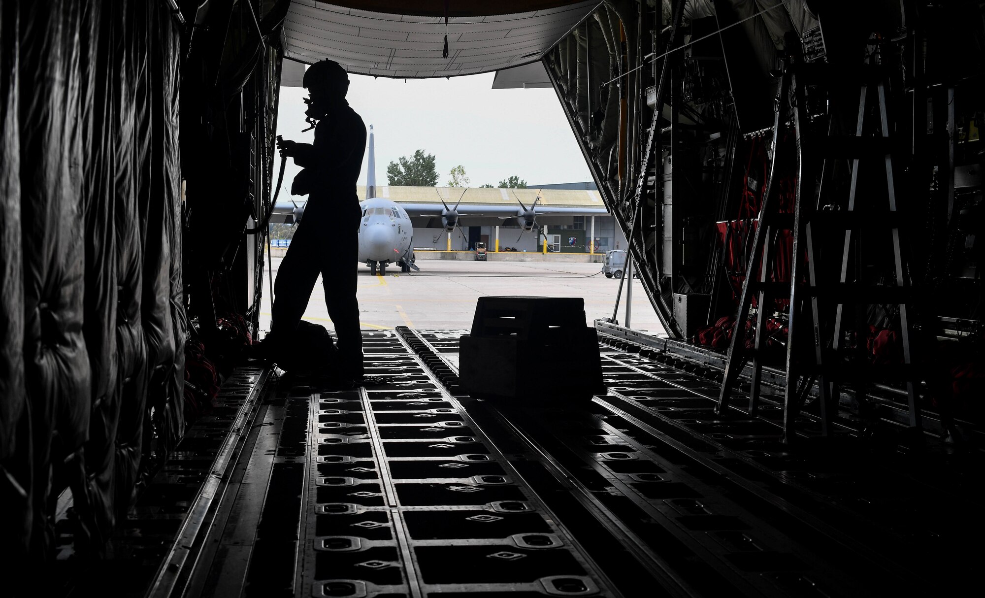 U.S. Air Force Senior Airman Matthew Gee, 37th Airlift Squadron aircraft loadmaster, tests his oxygen mask on a C-130J Super Hercules before departure during Exercise Stolen Cerberus IV at Elefsis Air Base, Greece, April 19, 2017. Throughout the exercise, Gee and other loadmasters have worked alongside the U.S. Army and Hellenic air force to perform personnel, heavy equipment, platforms, container delivering system bundles, and low-cost low-altitude bundles. These interoperability air exercises help to maintain joint readiness. (U.S Air Force photo by Senior Airman Tryphena Mayhugh)