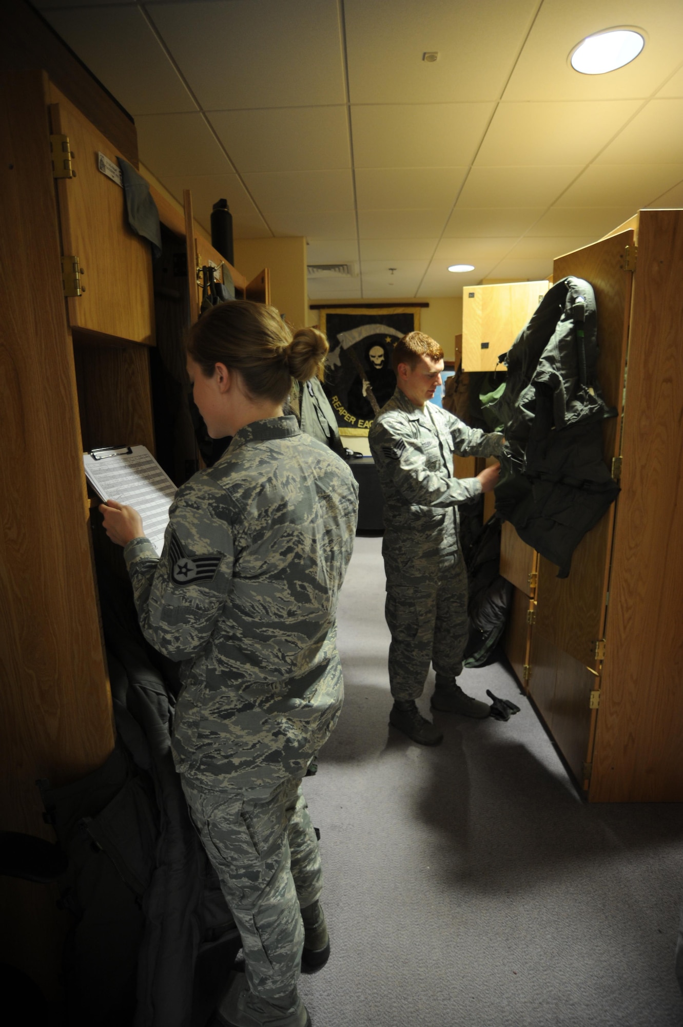 Staff Sgt. Bruce Gjetley, 388th Operations Support Squadron Aircrew Flight Equipment, and Staff Sgt. Samantha Barlond, 493rd Aircrew Flight Equipment, prepare and inspect an F-35A and F-15C pilots’ flight equipment prior to a sortie at RAF Lakenheath. Gjetley and about 250 other Airmen from the 388th and 419th Fighter Wings are deployed to Europe for training with units from the U.S. Air Force, Royal air force and air forces from other NATO Allies. The 34th Fighter Squadron has been sharing facilities with the 493rd Fighter Squadron which flies the F-15C. (U.S. Air Force photo/Micah Garbarino)