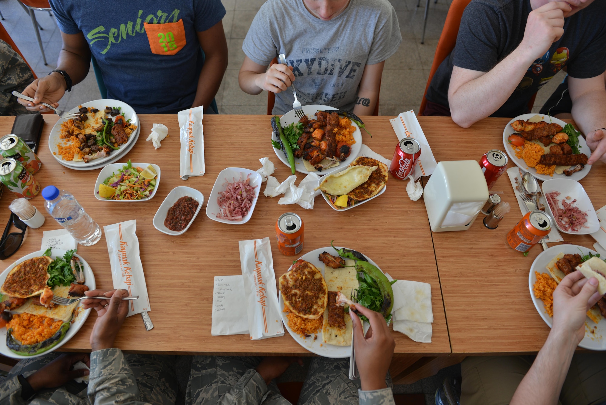 U.S. Airmen eat Turkish food together during a spiritual lunch and learn, April 27, 2017, at Diyarbakir Air Base, Turkey. During the luncheon, Airmen learned about each other’s values. (U.S. Air Force photo by Senior Airman John Nieves Camacho)