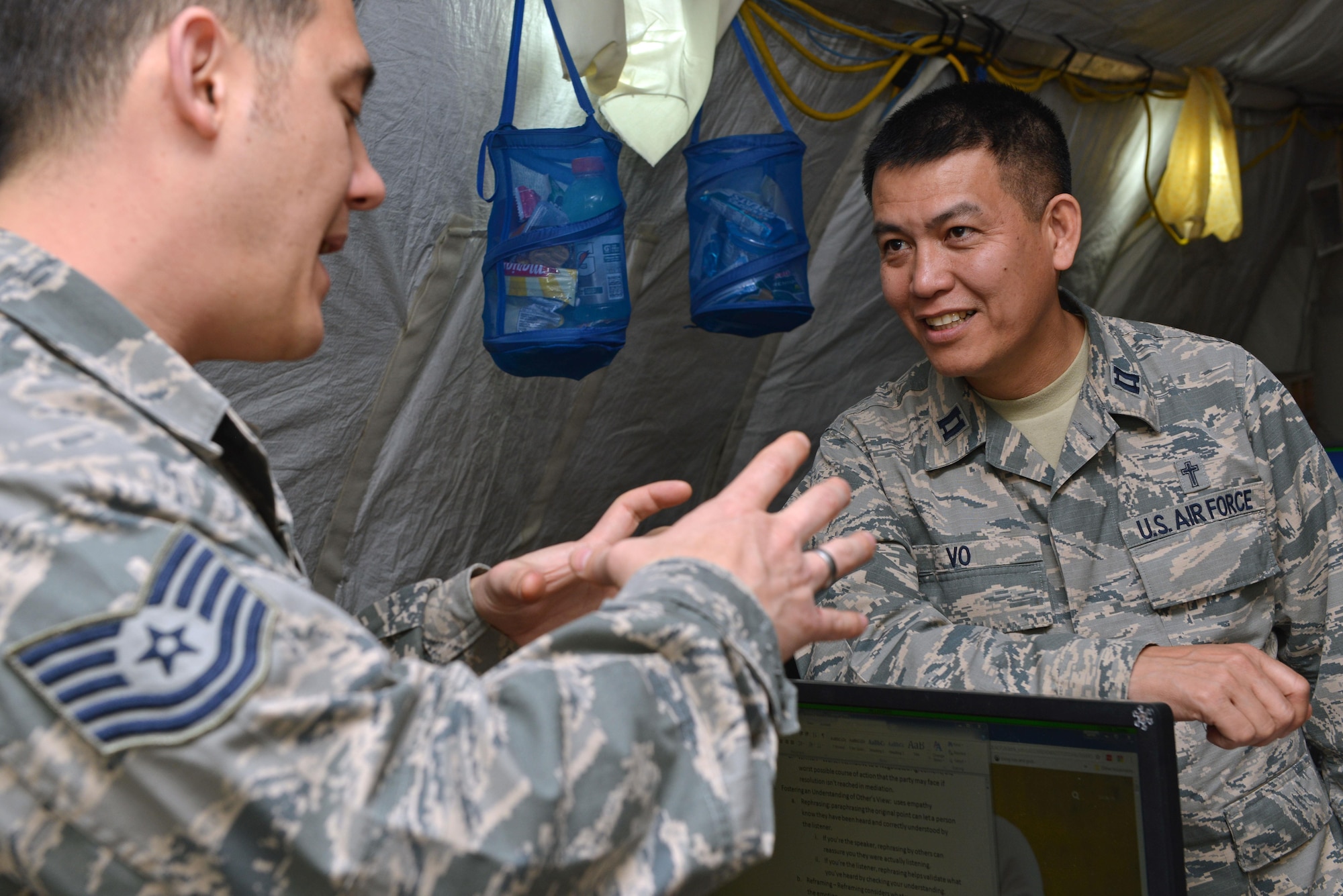 U.S. Air Force Chaplain (Capt.) Peter Vo (right), 31st Fighter Wing chaplain, speaks with an Airman, April 27, 2017, at Diyarbakir Air Base, Turkey. Chaplains visit units to learn about how they contribute to the mission and check on spiritual fitness. (U.S. Air Force photo by Senior Airman John Nieves Camacho)