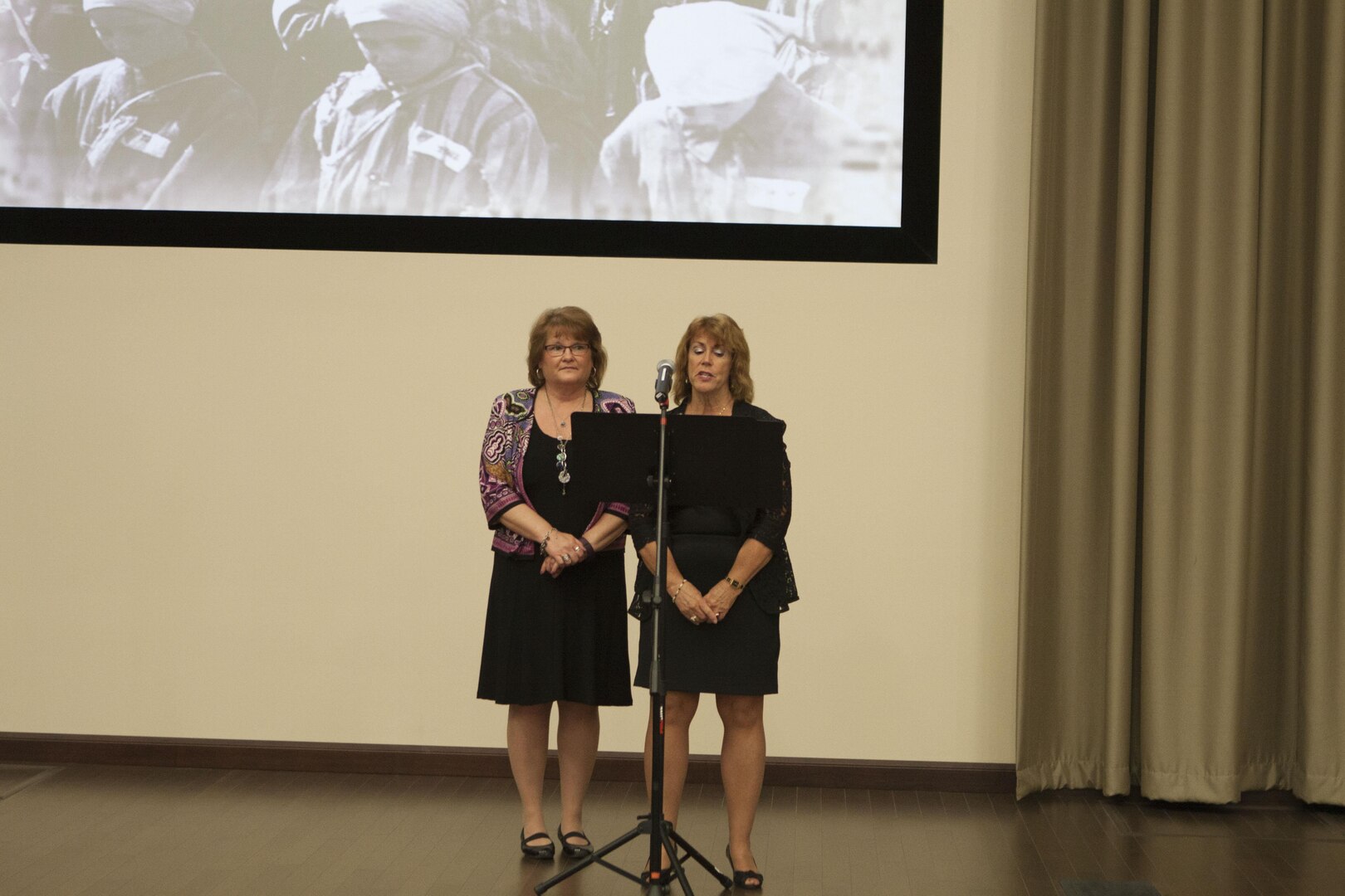 Rose Snavely-Howe, supervisor program analyst in DLA Distributions Acquisitions Operations and Sharon Heiner, a former DLA employee performed “When I am Silent” written by Joan Varner, during the Holocaust Remembrance Day event on Apr. 26. 