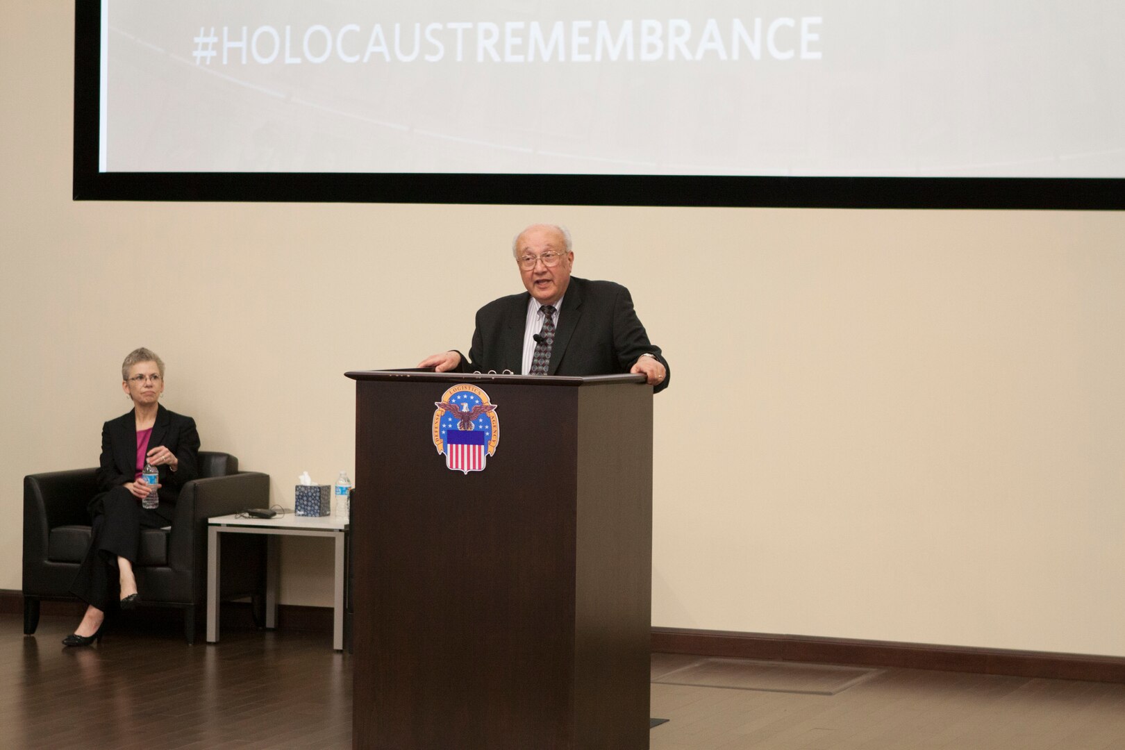 Employees of DLA Distribution Headquarters in New Cumberland, Pennsylvania, paid respect to Holocaust Remembrance Day on Apr. 26, with a presentation featuring Dr. Edward S. Beck, a retired college professor and professional counselor.