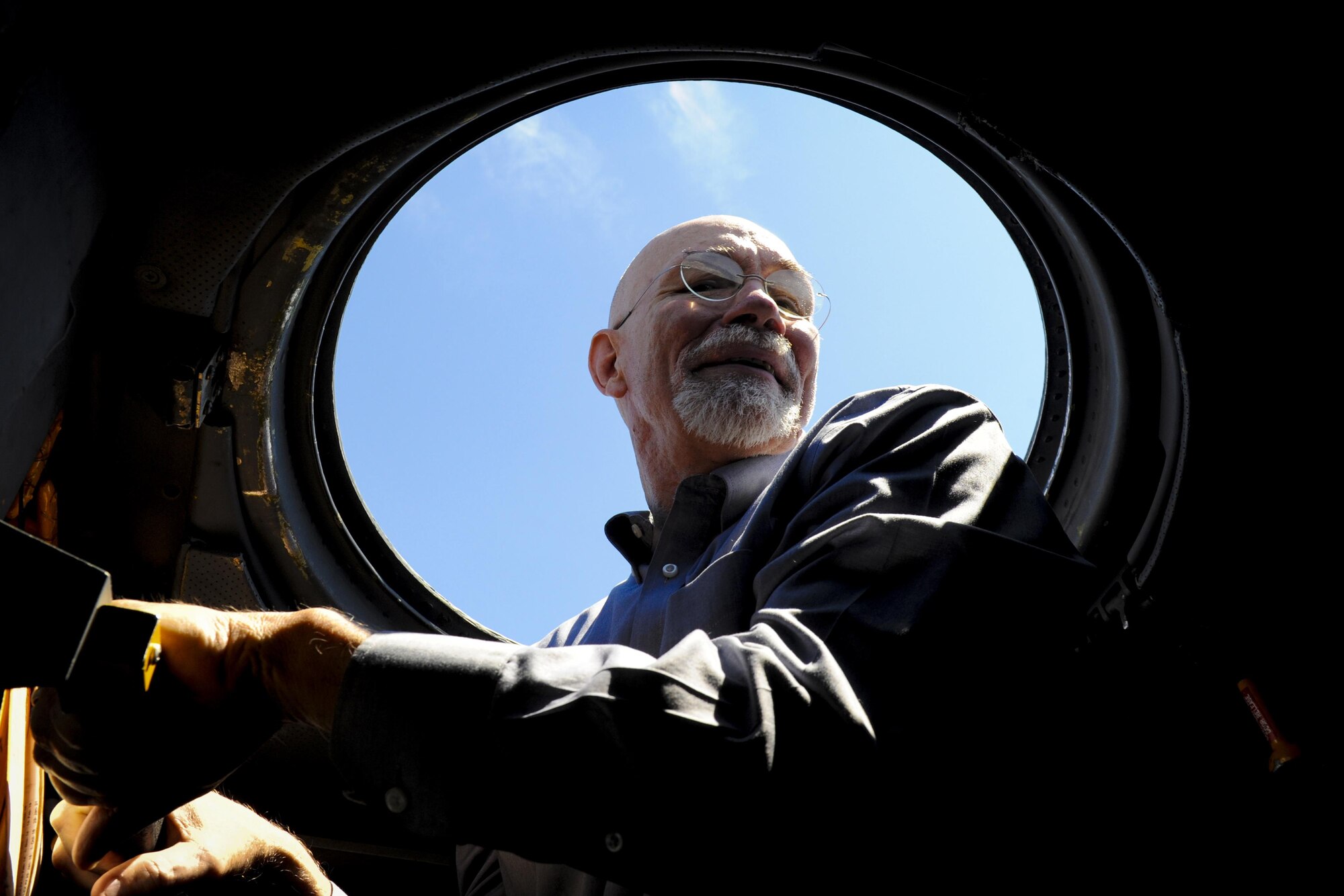 Joe Grider, a pastor at the First Presbyterian Church in Niceville, Fla., peers out an MC-130 Combat Talon II during a Clergy Day event at Hurlburt Field, Fla., April 25, 2017. The Hurlburt Field Chapel hosted local clergymen and provided insight to the  Air Commando culture and discussed the unique experiences Airmen face. (U.S Air Force photo by Airman 1st Class Dennis Spain)