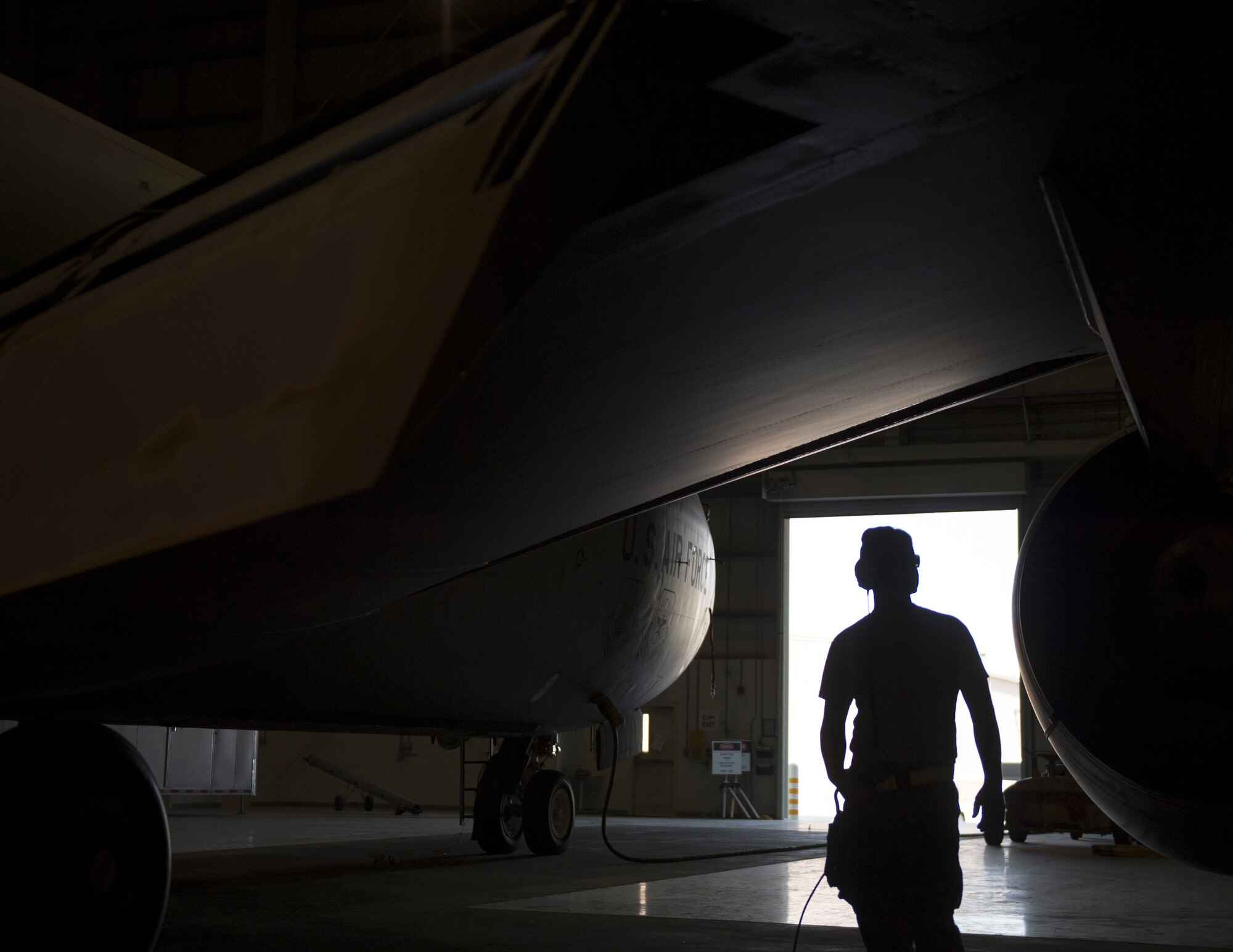 U.S. Air Force Tech. Sgt. Christian Runyon, fuel systems technician with the 379th Expeditionary Maintenance Squadron, watches the flaps go back up on a KC-135 Stratotanker after the gravity transfer valve operational check was completed at Al Udeid Air Base, Qatar, April 24, 2017. Completing the gravity transfer valve operational check helps ensure that the fuel system won’t malfunction during flight. (U.S. Air Force photo by Tech. Sgt. Amy M. Lovgren)