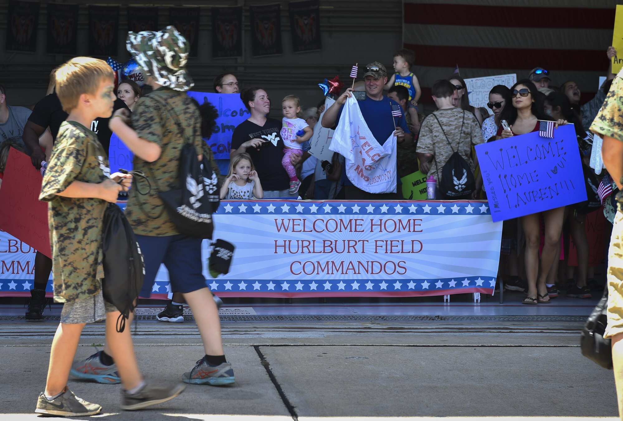 Parents await the arrival of their children at a homecoming event during Operation Kids Understanding Deployment Operations at Hurlburt Field, Fla., April 22, 2017. The homecoming event helped showed children what it feels like to return to family members after a deployment. (U.S. Air Force photo by Airman 1st Class Joseph Pick)