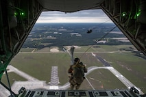 Senior Airman Matt, 38th Rescue Squadron pararescueman, jumps from an HC-130J Combat King II, April 24, 2017, at Moody Air Force Base, Ga. All PJs are qualified to conduct both static-line and High altitude, low opening jumps. During a static-line jump, the jumper is attached to the aircraft via the ‘static-line’, which automatically deploys the jumpers’ parachute after they’ve exited the aircraft. (U.S. Air Force photo by Staff Sgt. Ryan Callaghan)