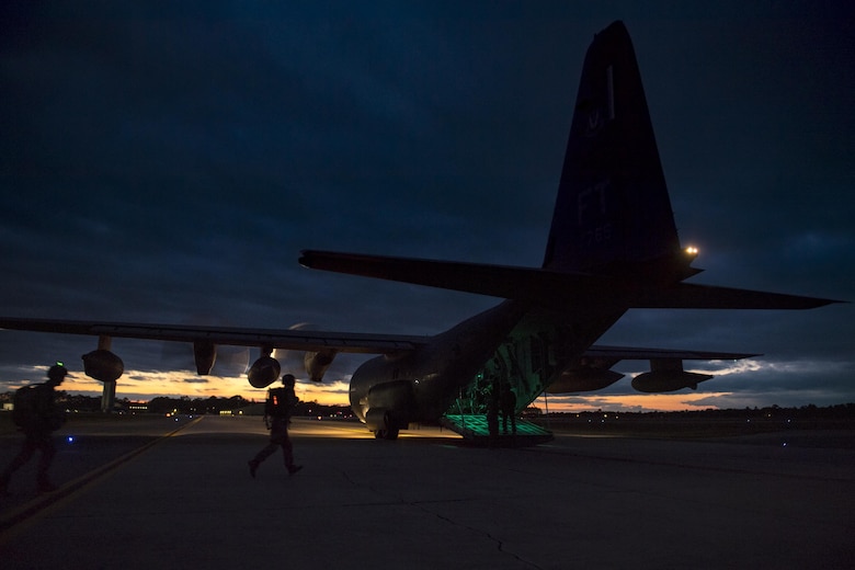 Pararescuemen from the 38th Rescue Squadron, run towards the rear of an HC-130J Combat King II during static-line jumps, April 24, 2017, at Moody Air Force Base, Ga. All PJs are qualified to conduct both static-line and High altitude, low opening jumps. During a static-line jump, the jumper is attached to the aircraft via the ‘static-line’, which automatically deploys the jumpers’ parachute after they’ve exited the aircraft. (U.S. Air Force photo by Staff Sgt. Ryan Callaghan)