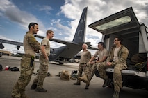 Senior Airman Matt, left, 38th Rescue Squadron pararescueman, laughs with fellow PJs prior to conducting static-line jumps, April 24, 2017, at Moody Air Force Base, Ga. All PJs are qualified to conduct both static-line and High altitude, low opening jumps. During a static-line jump, the jumper is attached to the aircraft via the ‘static-line’, which automatically deploys the jumpers’ parachute after they’ve exited the aircraft. (U.S. Air Force photo by Staff Sgt. Ryan Callaghan)