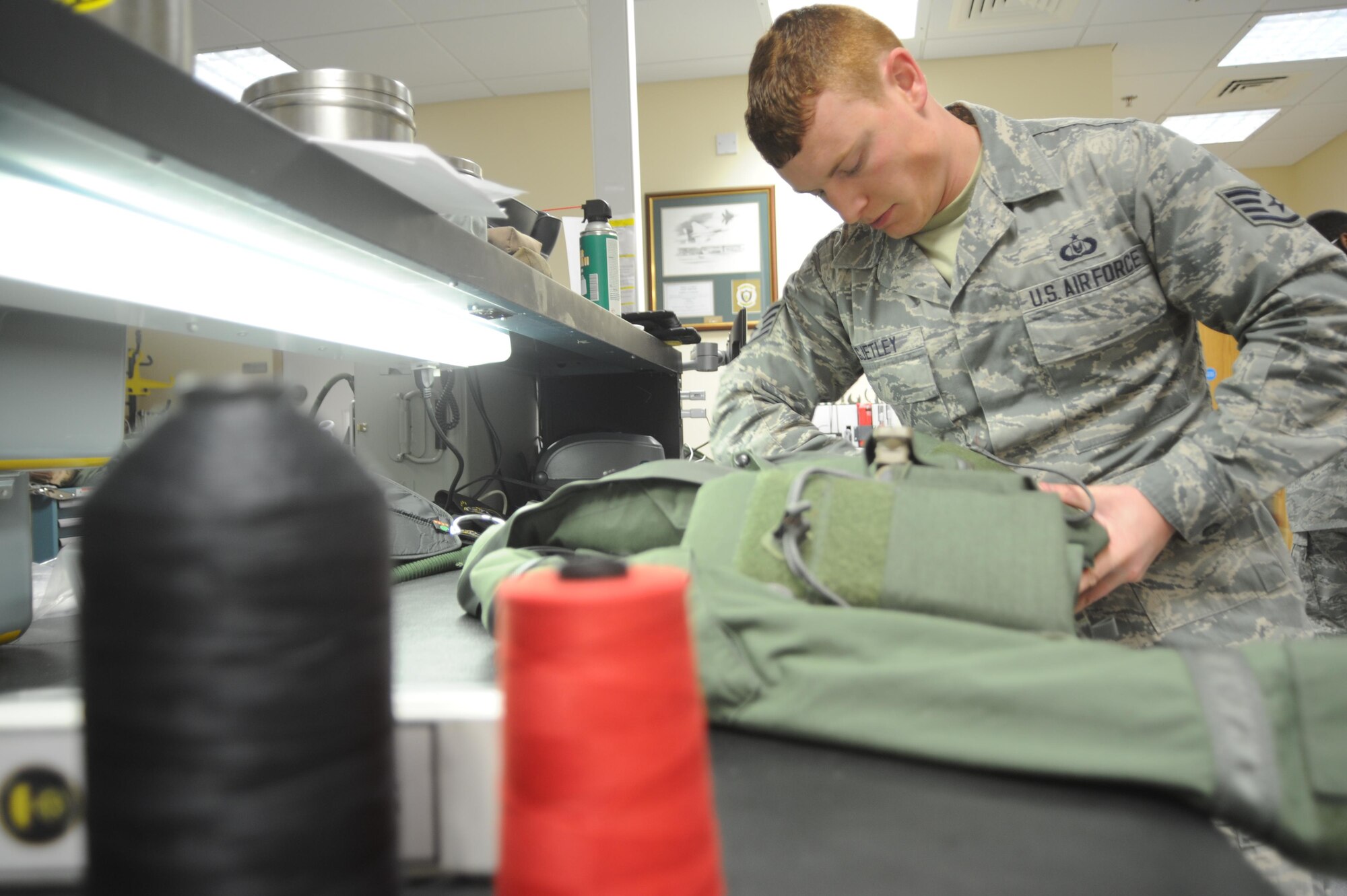 Staff Sgt. Bruce Gjetley, 388th Operations Support Squadron Aircrew Flight Equipment, prepares and inspects an F-35A pilot’s equipment prior to a sortie at Royal Air Force Lakenheath. Gjetley and about 215 other Airmen from the 388th and 419th Fighter Wings are deployed to Europe for training with units from the U.S. Air Force, Royal Air Force and air forces from other NATO allies. The 34th Fighter Squadron has been sharing facilities with the 493rd Fighter Squadron, which flies the F-15C. (U.S. Air Force photo/Micah Garbarino)