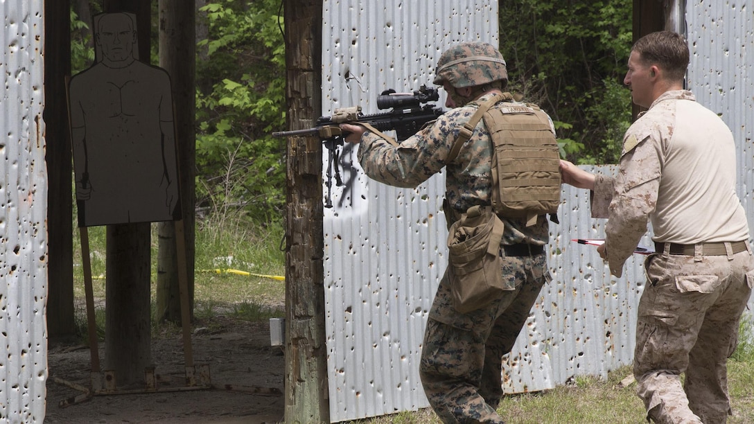 A Marine rushes into a shelter with his instructor during a sniper course exercise at Marine Corps Base Camp Lejeune, N.C., April 19, 2017. The Expeditionary Operations Training Group ran the course to teach long-range precision marksmanship to Marines from different units. The students are with the 2nd Reconnaissance Battalion and the battalion landing team with the 26th Marine Expeditionary Unit.