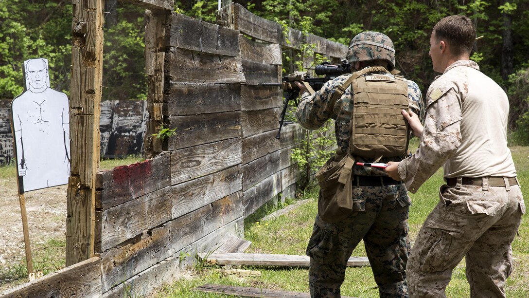 A Marine student and instructor approach a target on a sniper course at Marine Corps Base Camp Lejeune, N.C., April 19, 2017. The Expeditionary Operations Training Group ran the course to teach long-range precision marksmanship to Marines from different units. The students are with the 2nd Reconnaissance Battalion and the battalion landing team with the 26th Marine Expeditionary Unit.