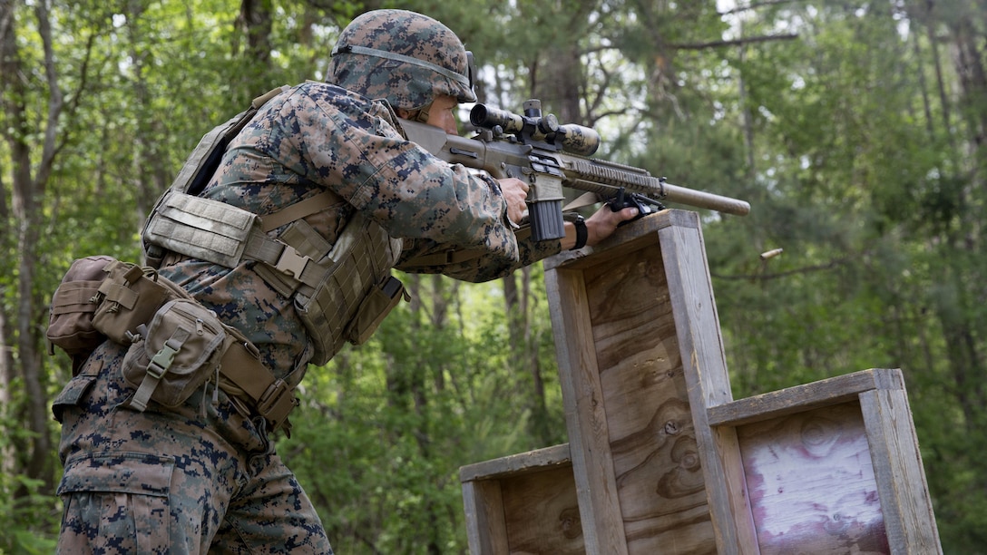 A Marine fires a blank round from behind a barricade during a sniper course at Marine Corps Base Camp Lejeune, N.C., April 19, 2017. The Expeditionary Operations Training Group ran the course to teach long-range precision marksmanship to Marines from different units. The students are with the 2nd Reconnaissance Battalion and the battalion landing team with the 26th Marine Expeditionary Unit.