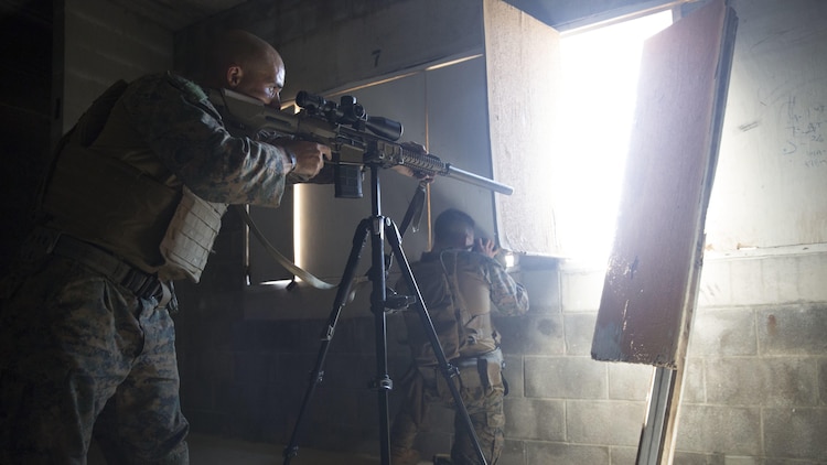 Marines team up to scout enemies during a Military Operations on Urban Terrain sniper course at Marine Corps Base Camp Lejeune, N.C., April 20, 2017. The Expeditionary Operations Training Group ran the course to teach long-range precision marksmanship to Marines from different units. The students are with the 2nd Reconnaissance Battalion and the battalion landing team with the 26th Marine Expeditionary Unit.
