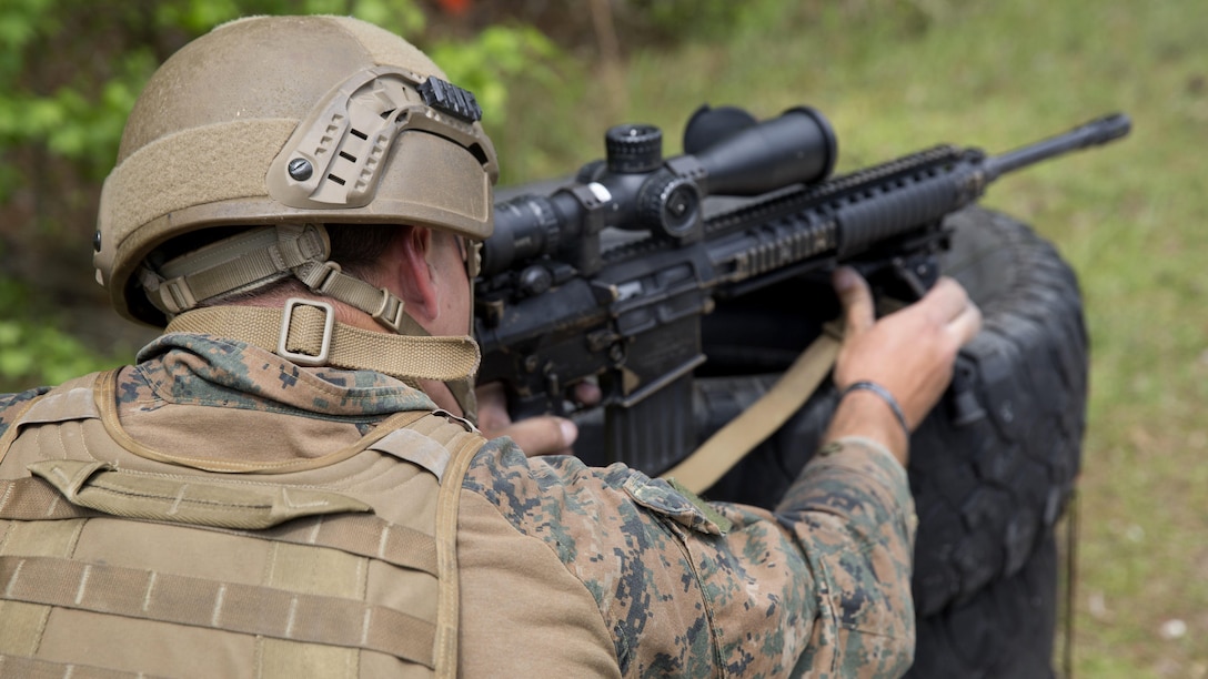 A Marine sights in on his target during an urban sniper course at Marine Corps Base Camp Lejeune, N.C., April 19, 2017. The Expeditionary Operations Training Group ran the course to teach long-range precision marksmanship to Marines from different units. The students are with the 2nd Reconnaissance Battalion and the battalion landing team with the 26th Marine Expeditionary Unit.