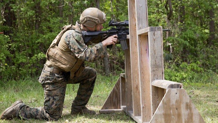 A Marine conceals himself as he sights in on his target during a sniper training course at Marine Corps Base Camp Lejeune, N.C., April 19, 2017. The Expeditionary Operations Training Group ran the course to teach long-range precision marksmanship to Marines from different units. The students are with the 2nd Reconnaissance Battalion and the battalion landing team with the 26th Marine Expeditionary Unit.