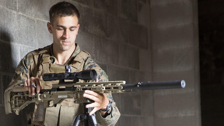 A Marine mounts his weapon to a tripod during a Military Operations on Urban Terrain sniper course at Marine Corps Base Camp Lejeune, N.C., April 20, 2017. The Expeditionary Operations Training Group ran the course to teach long-range precision marksmanship to Marines from different units. The students are with the 2nd Reconnaissance Battalion and the battalion landing team with the 26th Marine Expeditionary Unit.