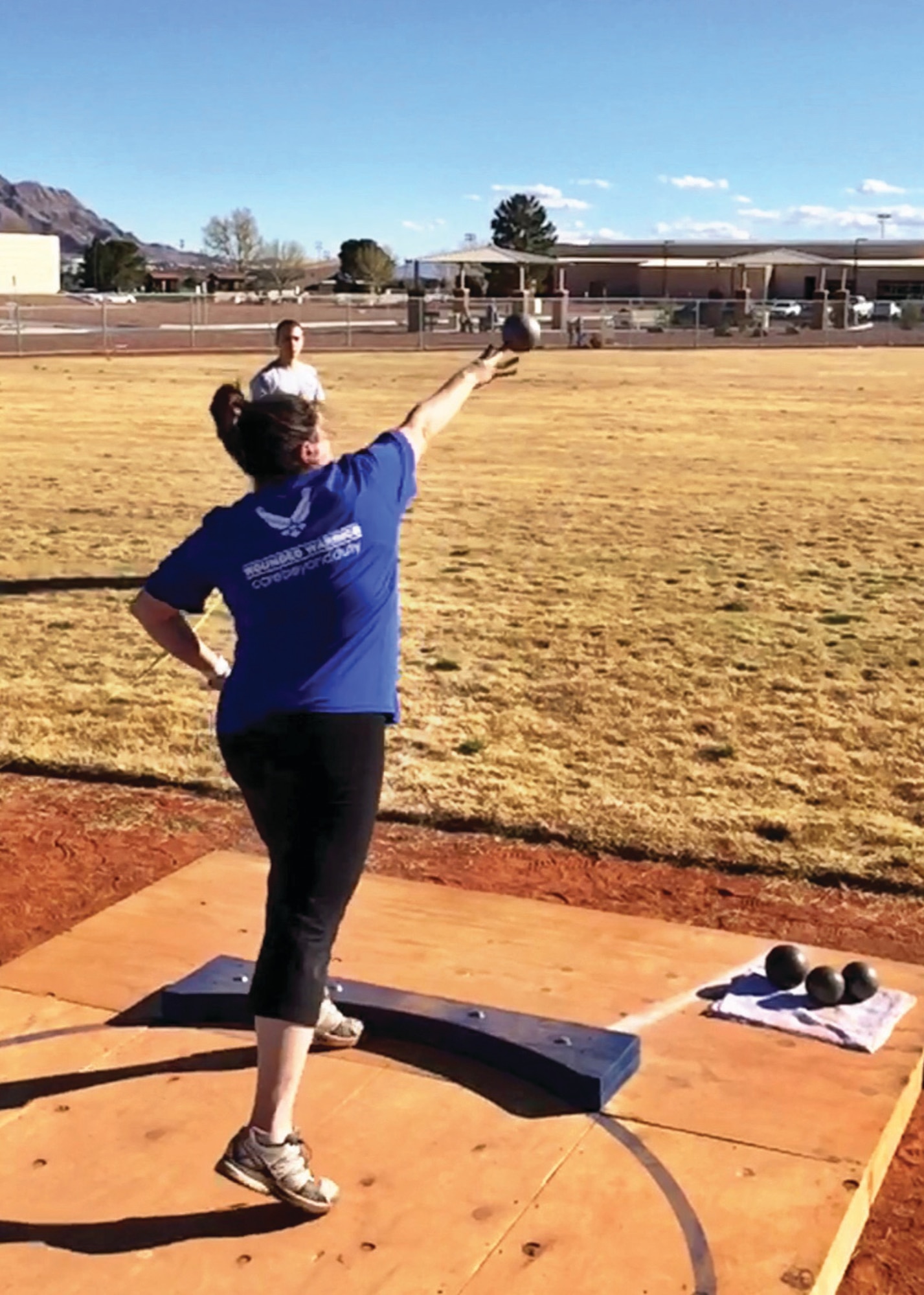 Lt. Col. Jackie Burns, 552nd Air Control Group, 552nd Air Control Wing, competes in the shot putt event at the Wounded Warrior Trials held at Nellis Air Force Base, Nev. Feb. 17.  Burns earned three Silver Medals and one Bronze Medal and was selected to the primary Air Force team that will compete in the Warrior Games in Chicago June 30-July 8.    (Air Force photo by Marty Burns)