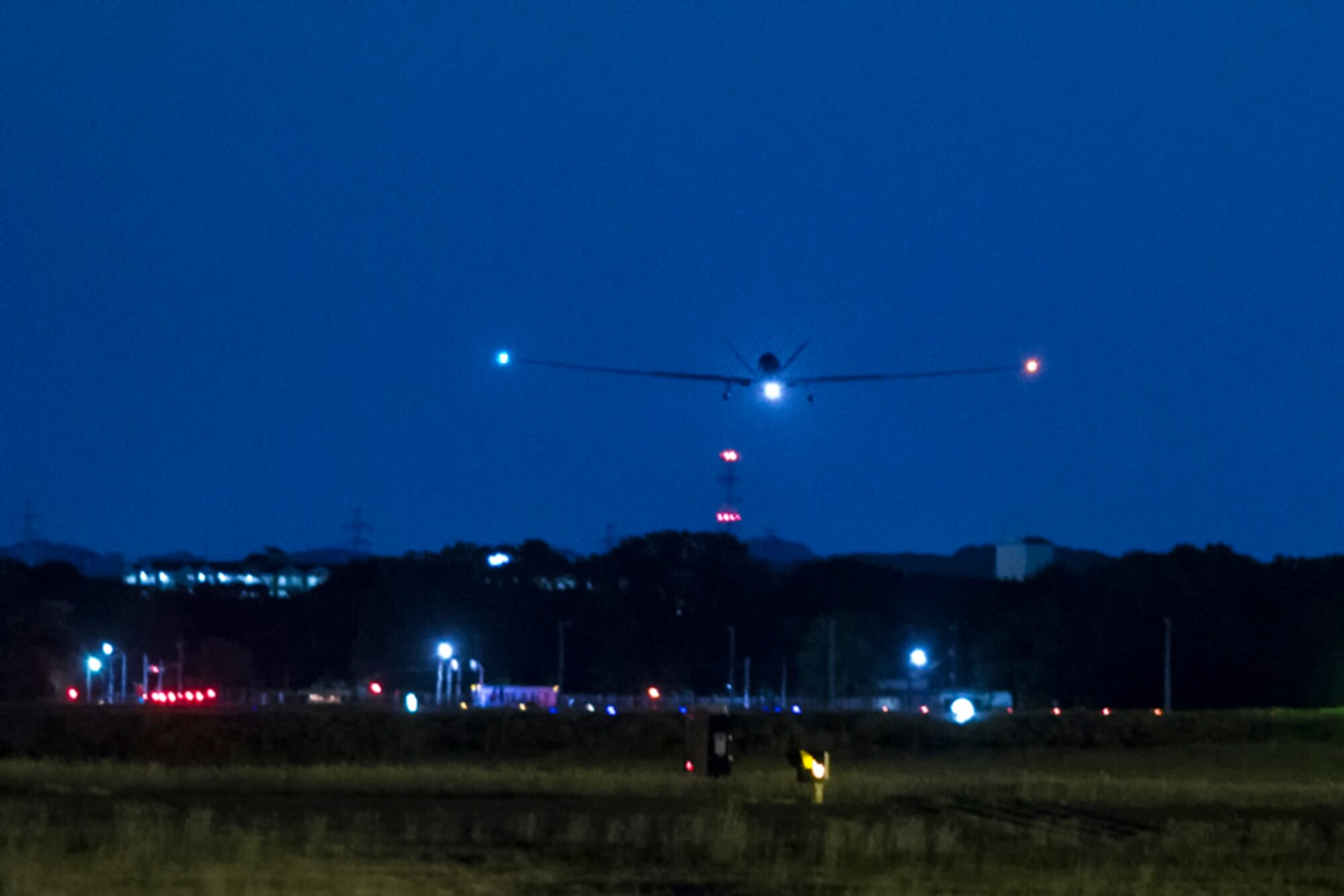 An RQ-4 Global Hawk approaches Yokota Air Base, Japan, May 1, 2017. The aircraft is part of the 69th Reconnaissance Group Detachment 1 and provides near real-time aerial imagery reconnaissance support to U.S. and partner nations assisting in multitude of operations. This capability was effectively employed during Operation Tomodachi, a relief effort launched when a 9.0-magnitude earthquake resulted in a tsunami that ravaged northeastern Japan in 2011. (U.S. Air Force photo by Yasuo Osakabe)