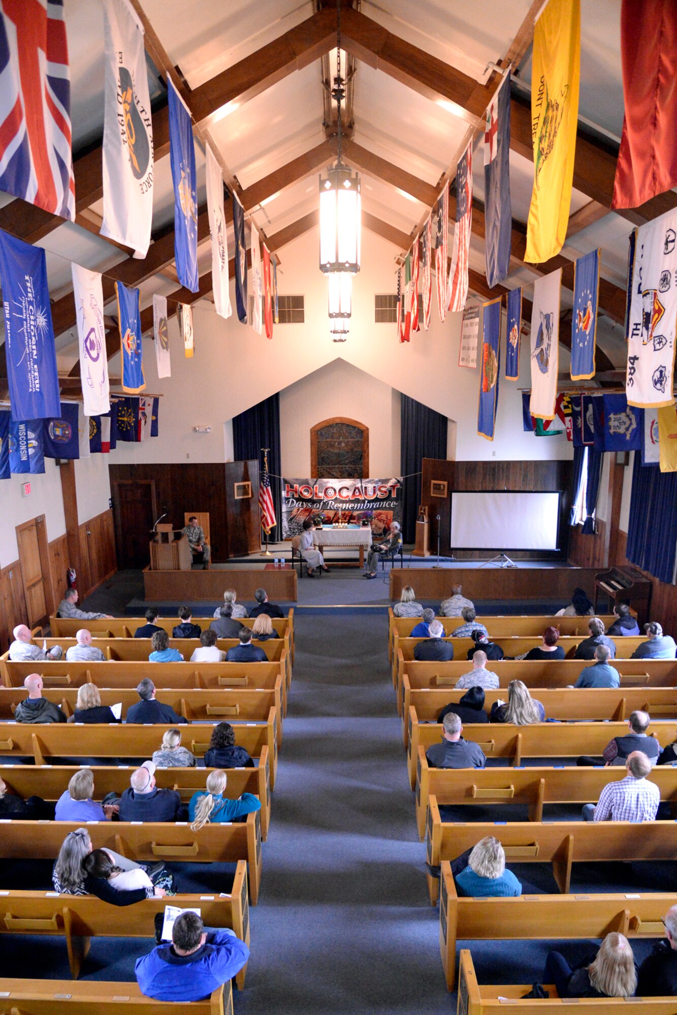 Attendees listen to guest speakers during the Holocaust Remembrance Day service at the Nate Mazar Chapel, April 25, 2017. Holocaust survivor Liesel Shineberg and Dr. Karen Hirsch were the event’s guest speakers. The service was organized by the Team Hill Special Observance Council, Holocaust Remembrance Committee. (Todd Cromar/U.S. Air Force) 