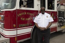 Harvey Stevens, 49th Civil Engineer Squadron deputy fire chief, poses for a photo in front of fire engine 14 at Holloman Air Force Base on April 27, 2017. Stevens retired on April 28, 2017 after 50 years of service. (U.S. Air Force Photo by Tech. Sgt. Amanda Junk)