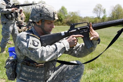 Maj. Daniel Rodriguez, with the 83rd U.S. Army Reserve Readiness Training Command, adjusts his hands and weapon for the kneeling firing position.  U.S. Army Reserve Soldiers from 20 different units across the nation gathered for the 2017 U.S. Army Reserve Midwestern Small Arms Championship at Camp Atterbury, Indiana April 21-25.