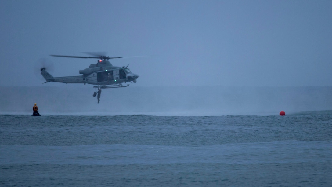 U.S. Marine jumps out of a UH1-Z Huey, into the ocean off the shore of  San Onofre beach during the helocast section of the 9th annual Reconnaissance Challenge at Marine Corps Base Camp Pendleton, California, April 27, 2017. The Reconnaissance Challenge is a memorial event held to honor the fallen recon Marines. The event consisted of 24 miles of hiking, helocasting, scout swimming, memory challenge, obstacle course, close quarters tactics, live-fire range and two pool stations. 