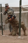 Sgt. Derek Ball and Spc. Antonio Bowden military policemen representing the 805th MP Company from Cary N.C., complete L-shaped hall clearing during Exercise African Lion 17 April 24, at Tifnit, Morocco. African Lion conducts a joint, multilateral exercise that promotes interoperability and mutual understanding of countries’ tactics, techniques, and procedures while reinforcing the bonds forged between their militaries.