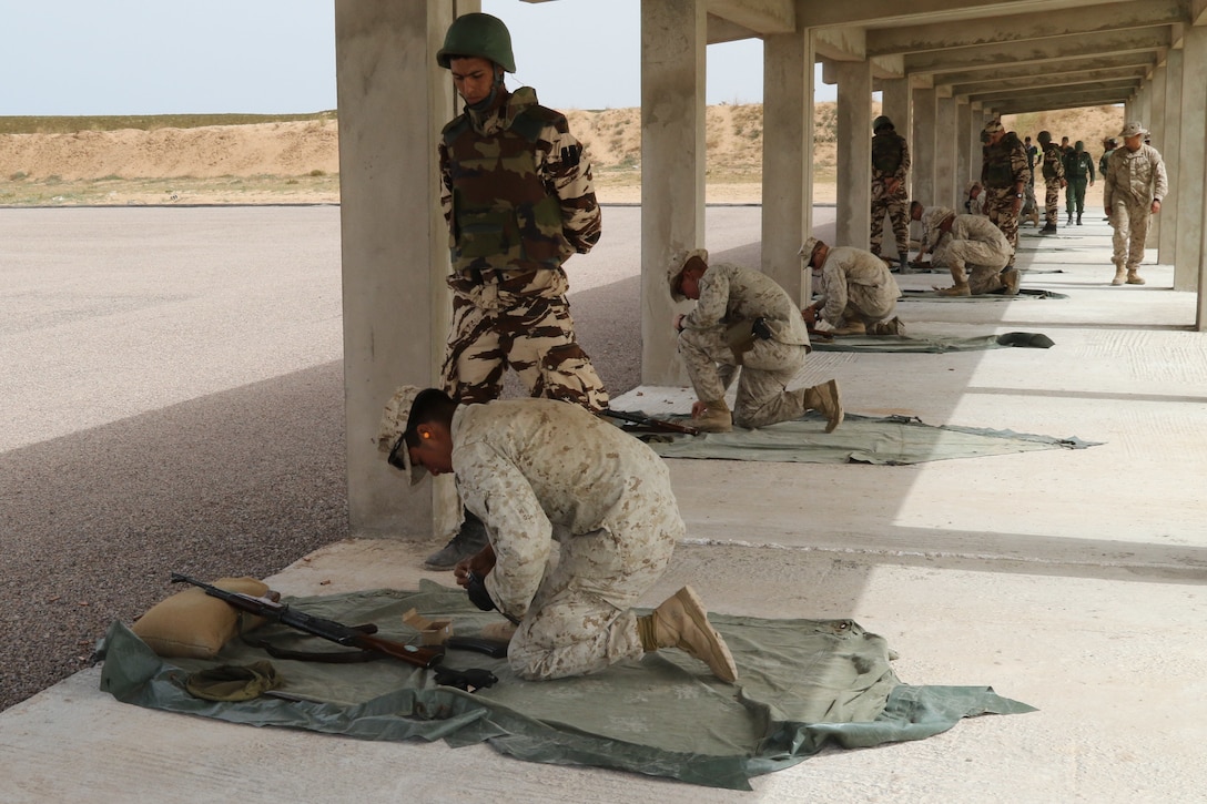 Alpha 3rd Marine Fleet Antiterrorism Security Team (FAST) from Yorkstown Va., completes weapons training with Royal Moroccan Armed Forces during Exercise African Lion April 22, at Tifnit, Morocco. Exercise African Lion is an annually scheduled, combined multilateral exercise designed to improve interoperability and mutual understanding of each nation’s tactics, techniques and procedures.