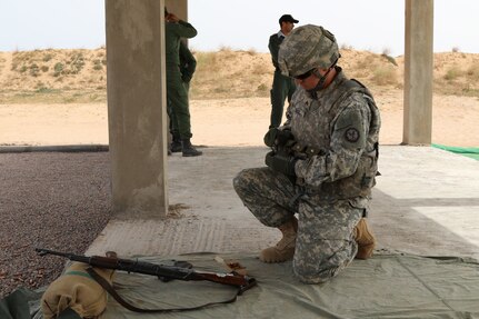 Sgt. Derek Ball a military policeman representing the 805th MP Company from Cary N.C., completes weapons training with Royal Moroccan Armed Forces during Exercise African Lion April 22, at Tifnit, Morocco. Exercise African Lion is an annually scheduled, combined multilateral exercise designed to improve interoperability and mutual understanding of each nation’s tactics, techniques and procedures.