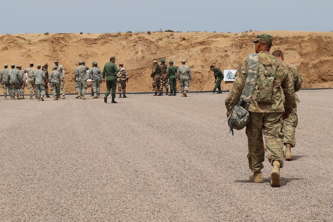 Soldiers representing the 805th Military Police Company and the Alpha 3rd Marine Fleet Antiterrorism Security Team (FAST) complete weapons training during Exercise African Lion April 22, at Tifnit, Morocco. Exercise African Lion is an annually scheduled, combined multilateral exercise designed to improve interoperability and mutual understanding of each nation’s tactics, techniques and procedures.