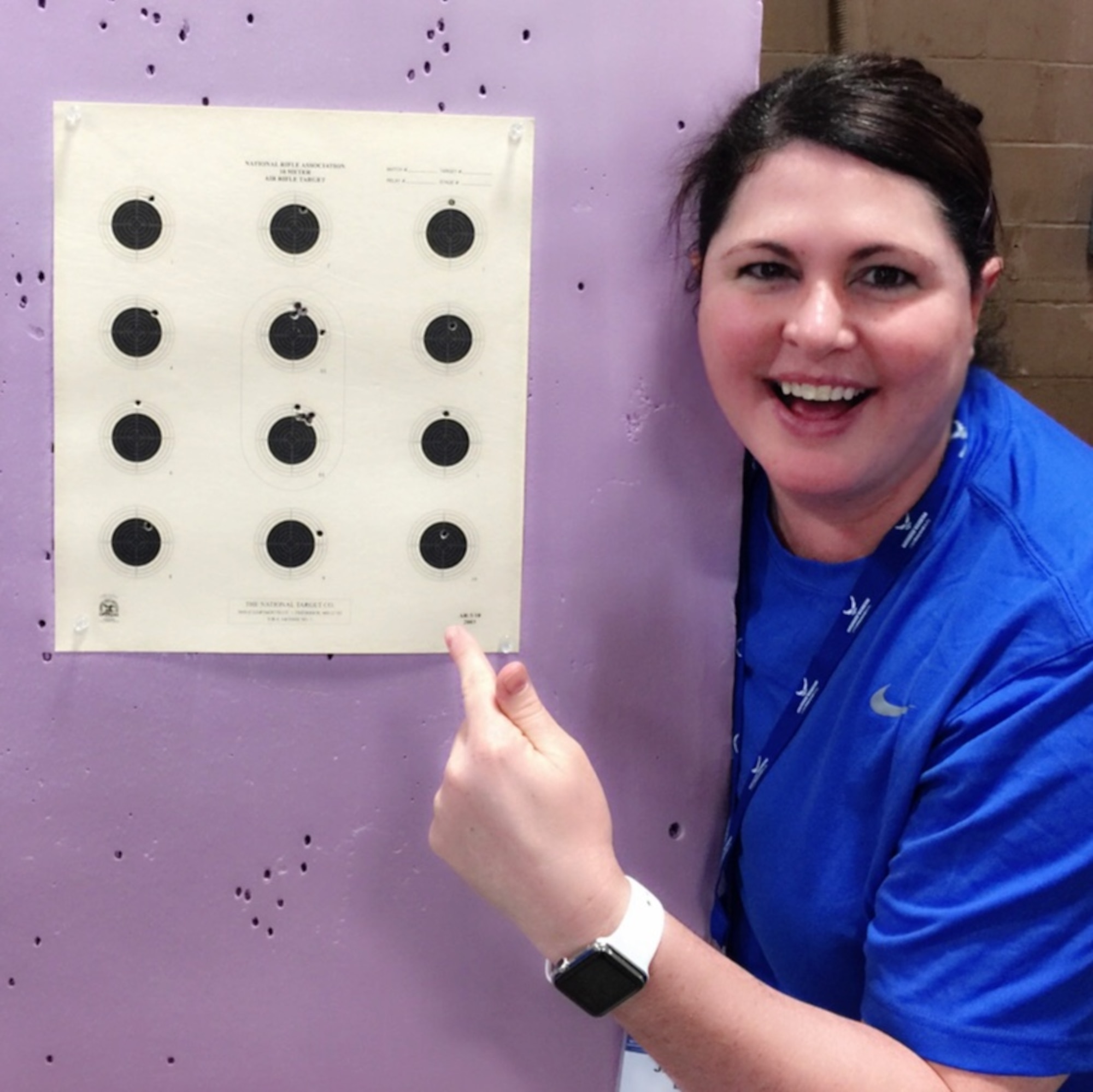 Lt. Col. Jackie Burns, 552nd Air Control Group, 552nd Air Control Wing, points at her target. She competed in the Wounded Warrior Trials Feb. 17, at Nellis Air Force Base, Nev.  For her efforts, Burns earned a spot as an alternate on the Air Pistol team. Over all she won three Silver Medals and one Bronze Medal and a primary spot on the Air Force Wounded Warrior team that will compete in the Warrior Games June 30-July 8 in Chicago,  (Courtesy photo)